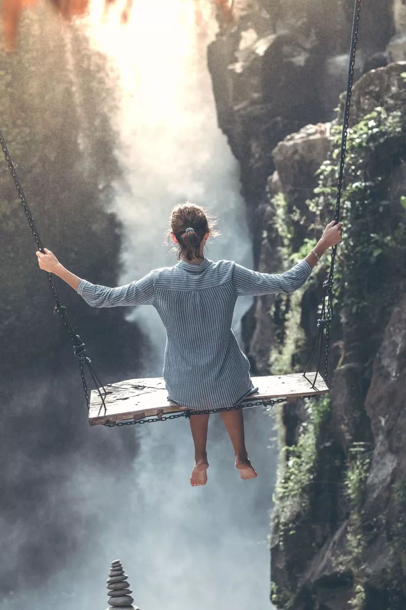 A woman hanging and enjoying mountain view