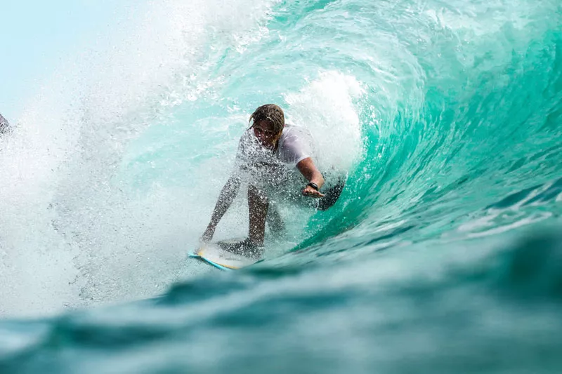 A boy doing surfing