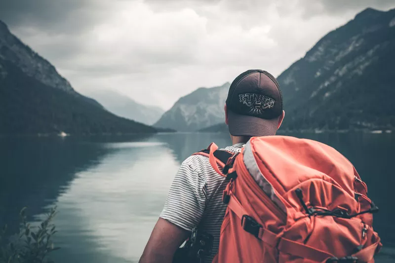 Mountain with river in between and a person